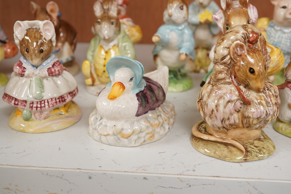 Twenty Beatrix Potter figures, mostly later production figures, largest 11cm high